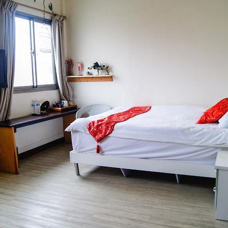 Ding Ding Homestay Цзіньху Номер фото