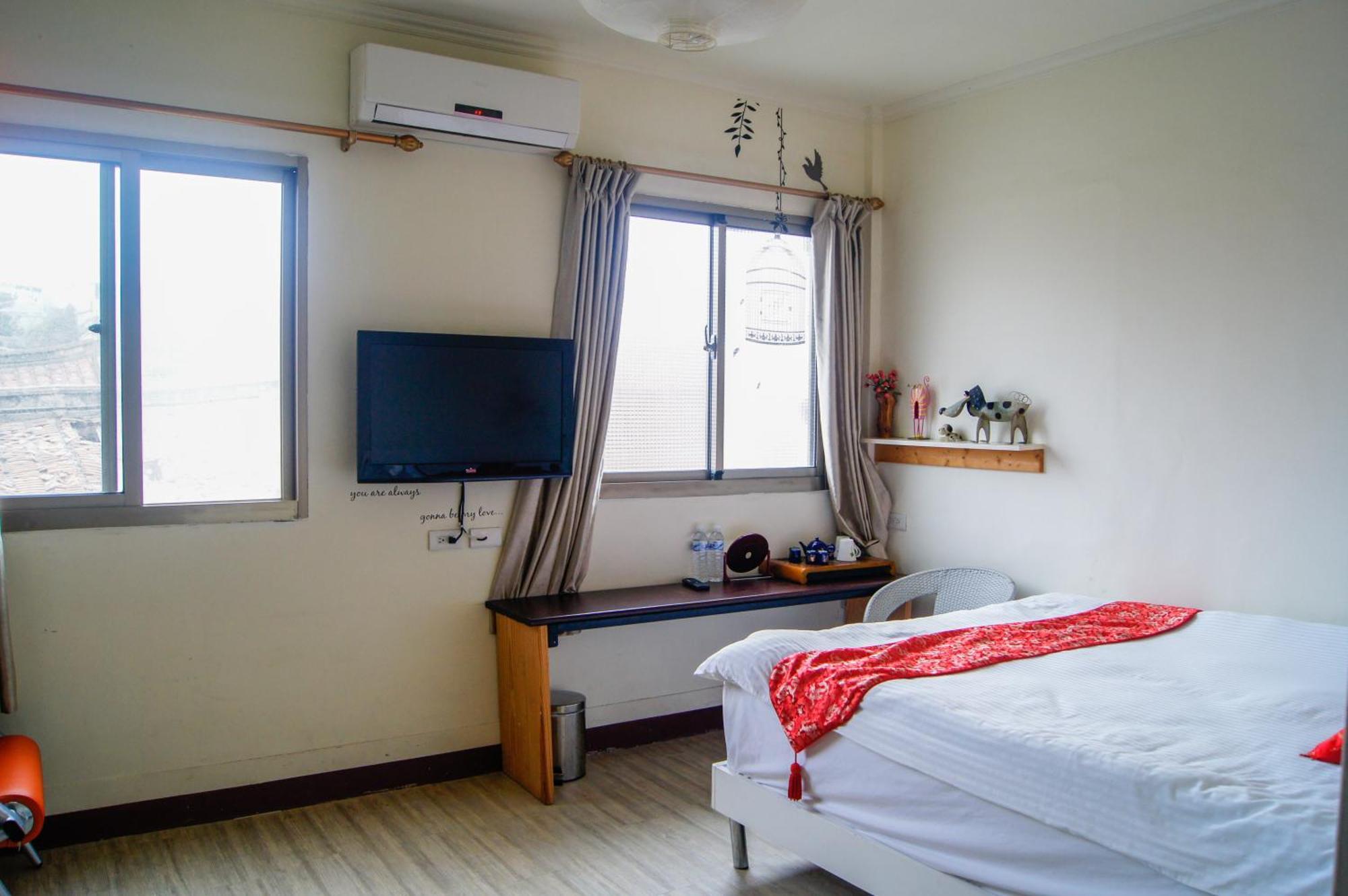 Ding Ding Homestay Цзіньху Номер фото